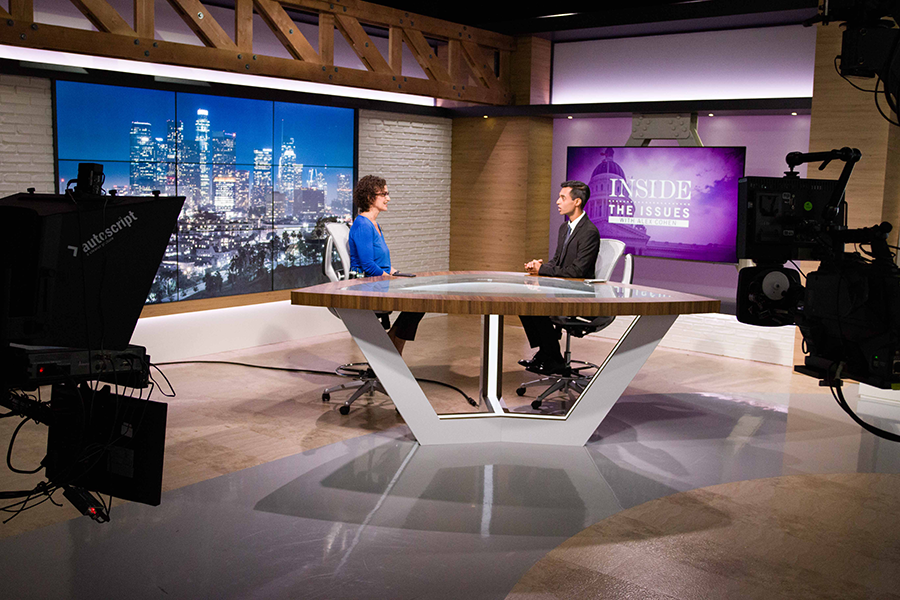 Journalists Alex Cohen and Amrit Singh prep for their political show